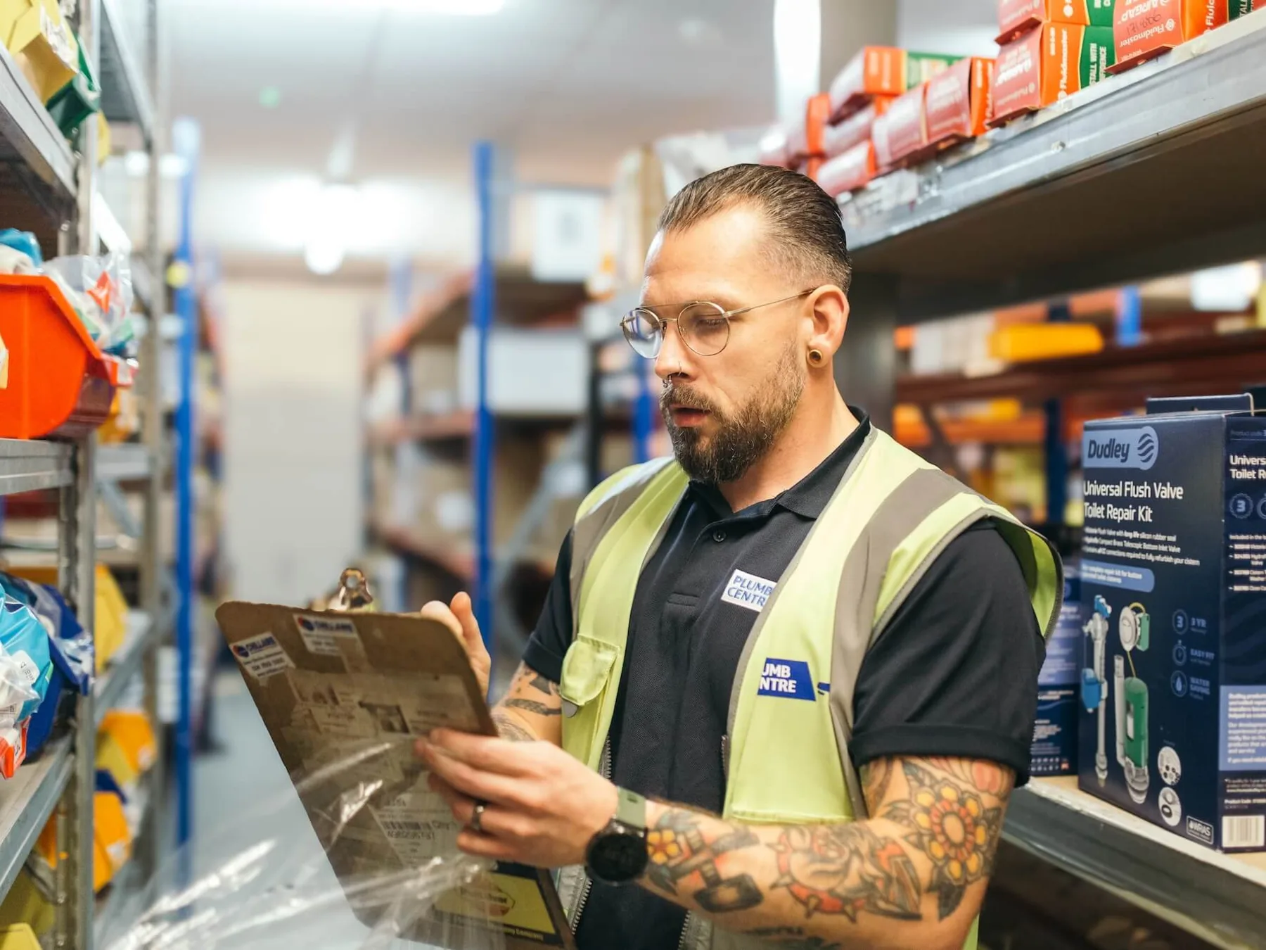A Wolseley Plumb Centre colleague managing stock in a branch
